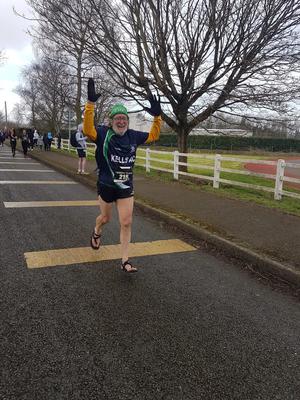 Photo at end of half-marathon in March 2022