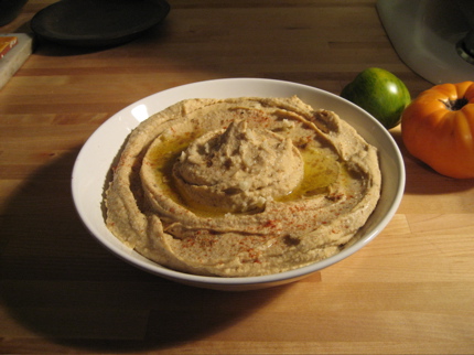 homemade hummus in a white bowl