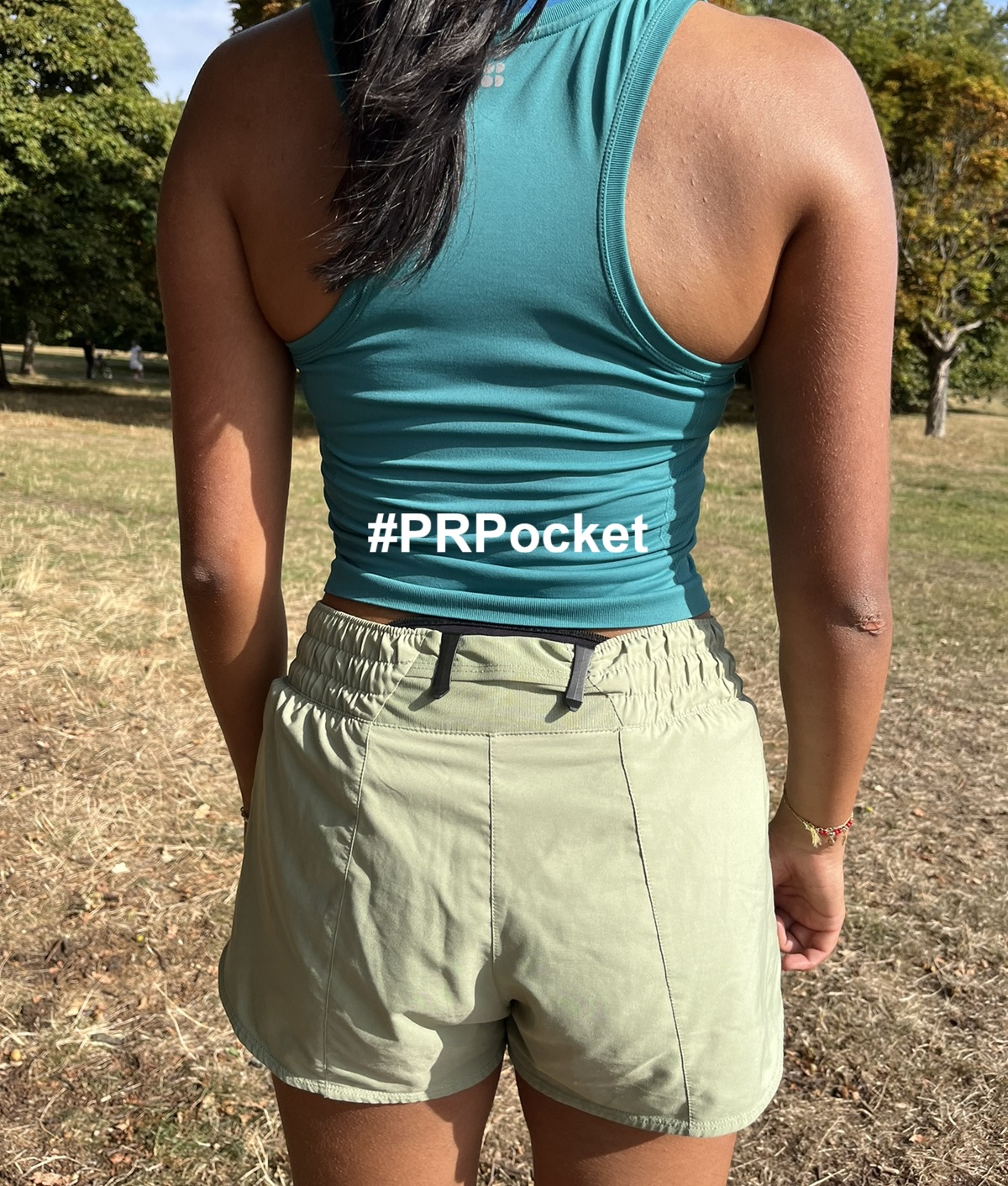 Female Runner wearing #PRPocket to carry phone while running