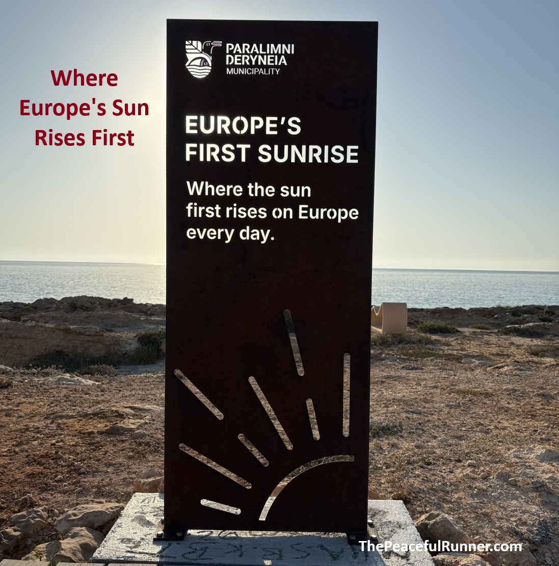 Sign on the rocky coast reading Europe's First Sunrise, where the sun first rises on Europe