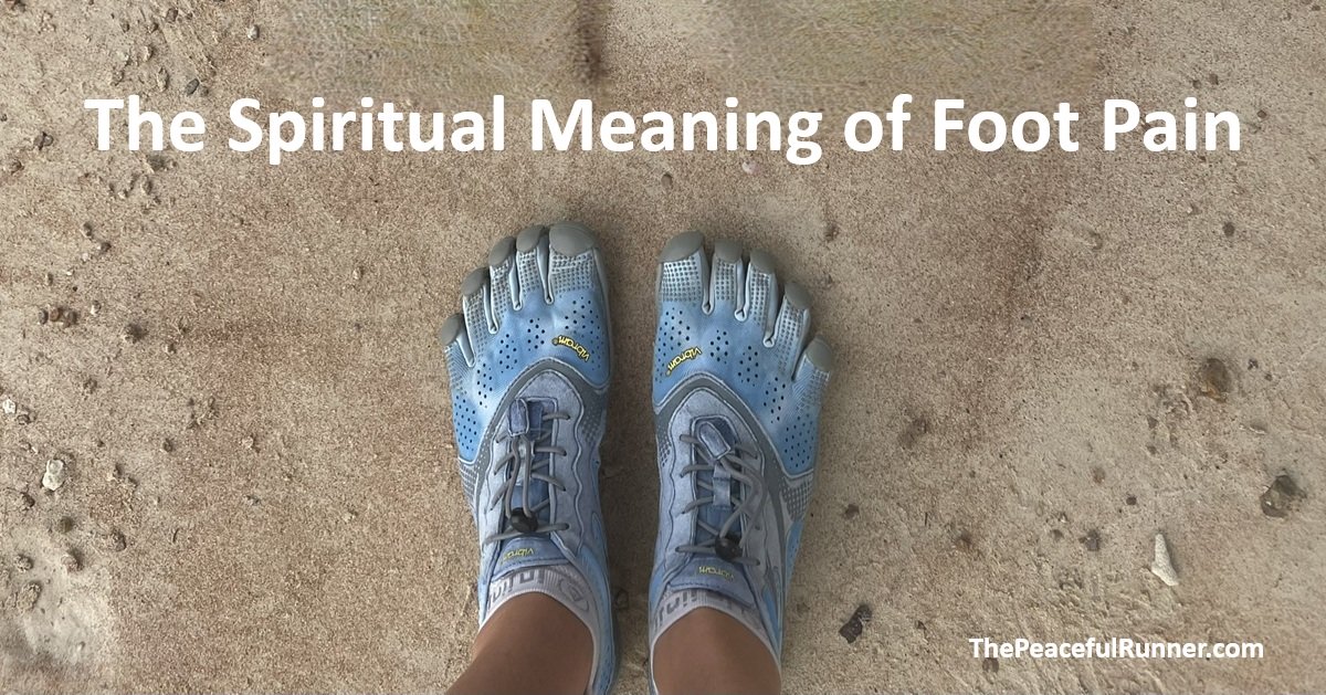 Foot pain spiritual meaning: a runner standing on sand in blue minimalist toe shoes